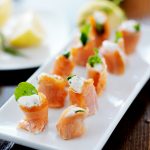 appetizer platter with smoked salmon, cream cheese, and arugula