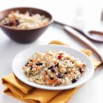 cold couscous salad with seeds and nuts on table top