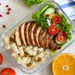 Lunch box: rotini with baked chicken breast and salad.